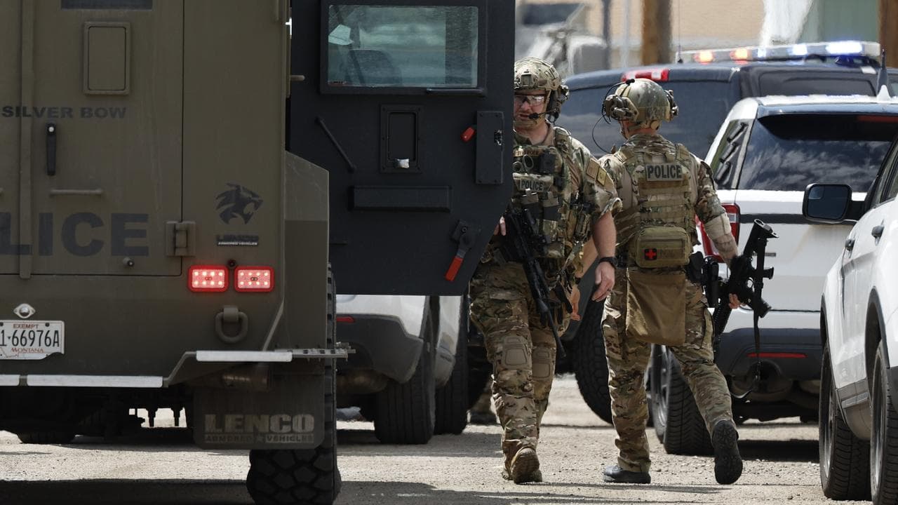 Law enforcement personnel respond to a reported shooting