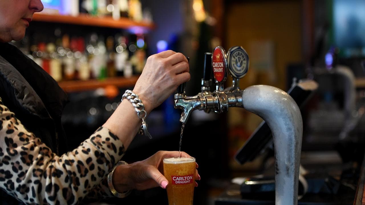 Bartender pours beer