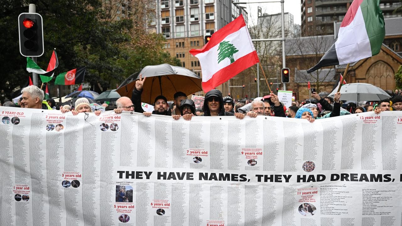 Protesters gather to walk the bridge