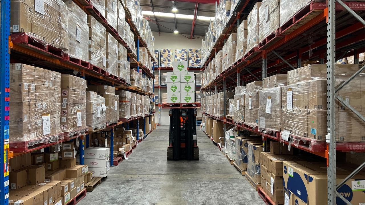 Good360 volunteers packing donated hygiene items