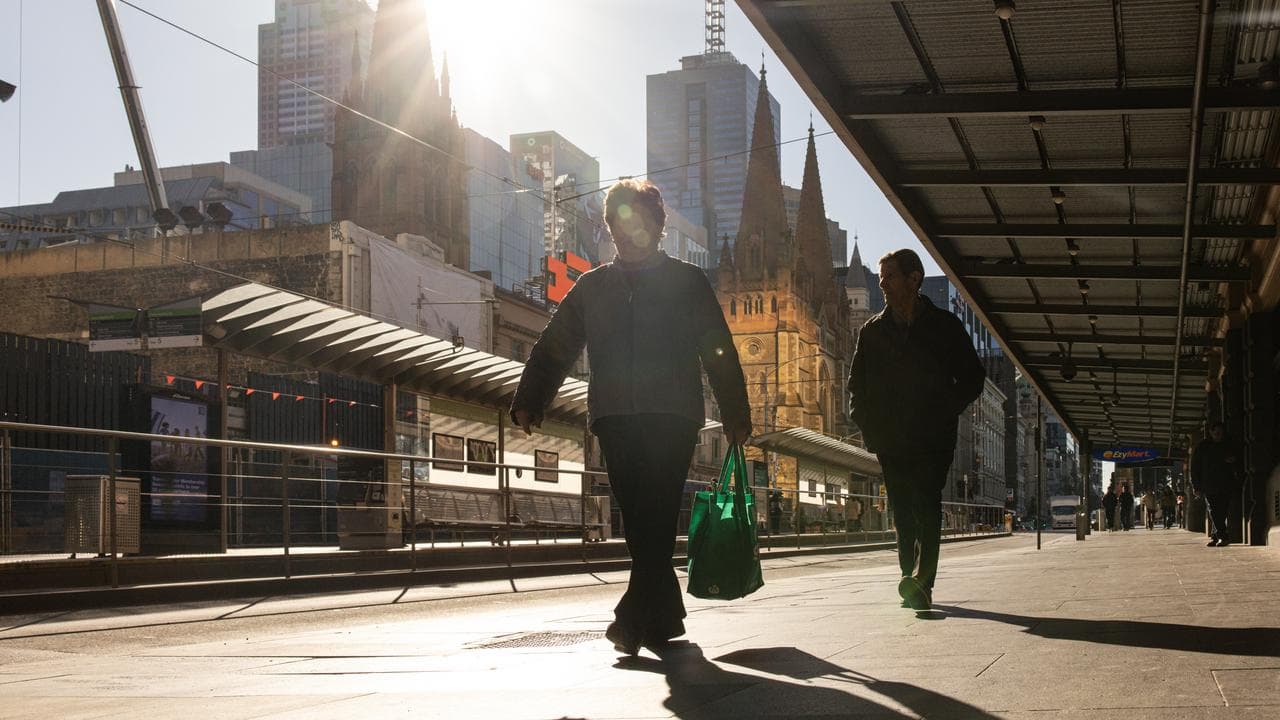 People are seen during a cold morning in Melbourne,