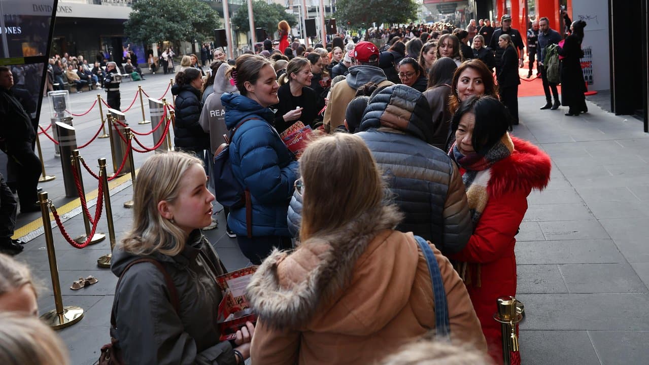 Lines of shoppers queuing in Melbourne