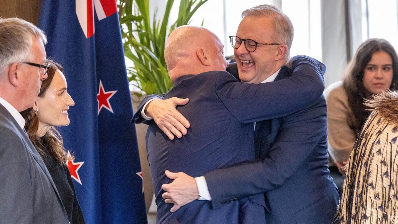 Christopher Luxon embraces Anthony Albanese