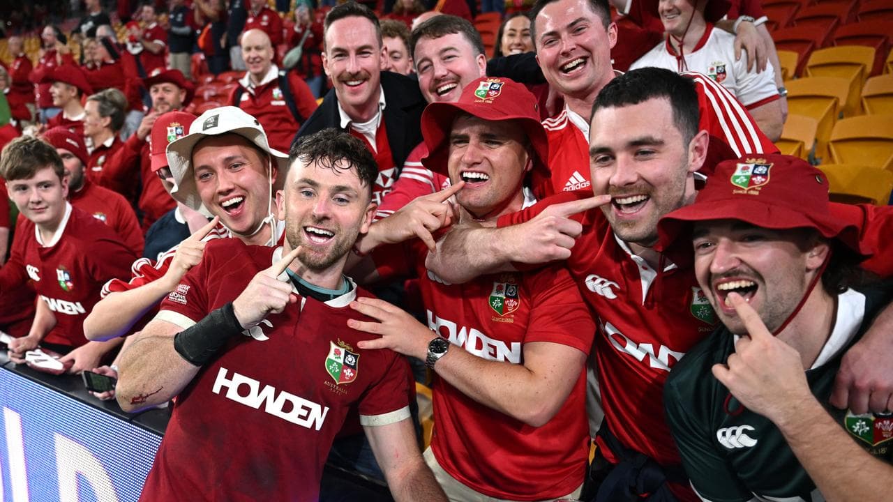 Hugo Keenan of the Lions reacts with fans