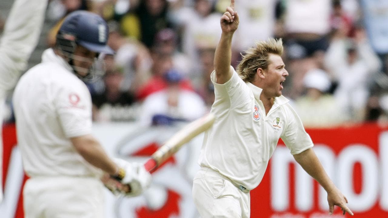 Shane Warne celebrates on the MCG after taking his 700th Test wicket.