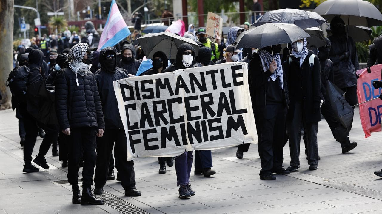 Counter-protesters participate in the Women Will Speak rally