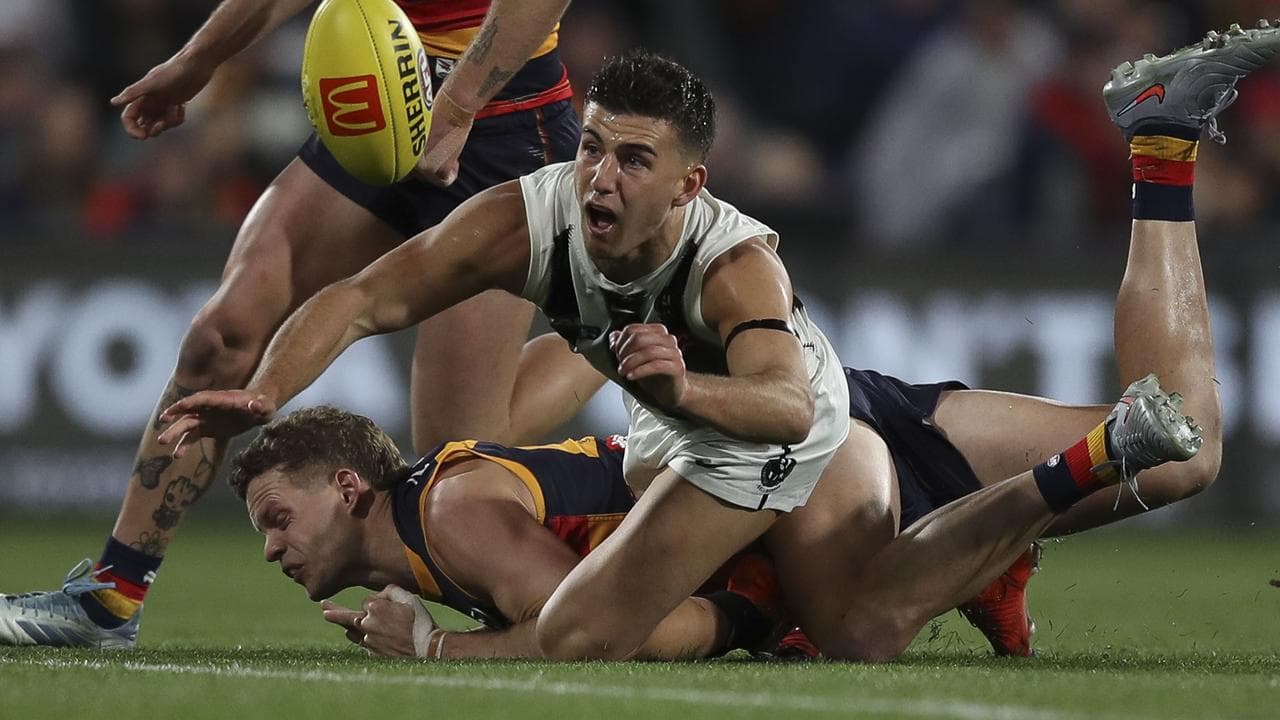 Collingwood's Nick Daicos and Adelaide's Mitchell Hinge.