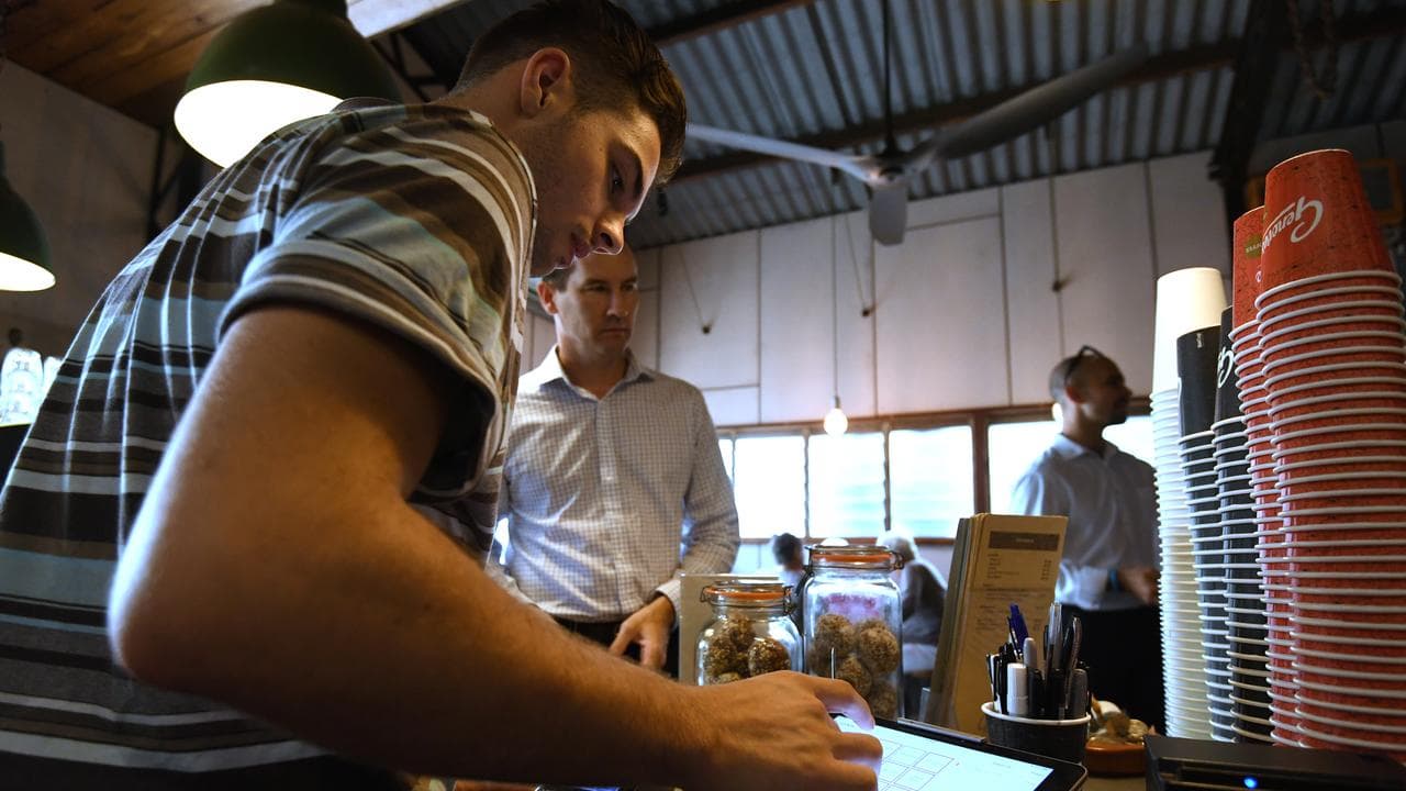 Stock image showing an employee at a restaurant in Brisbane