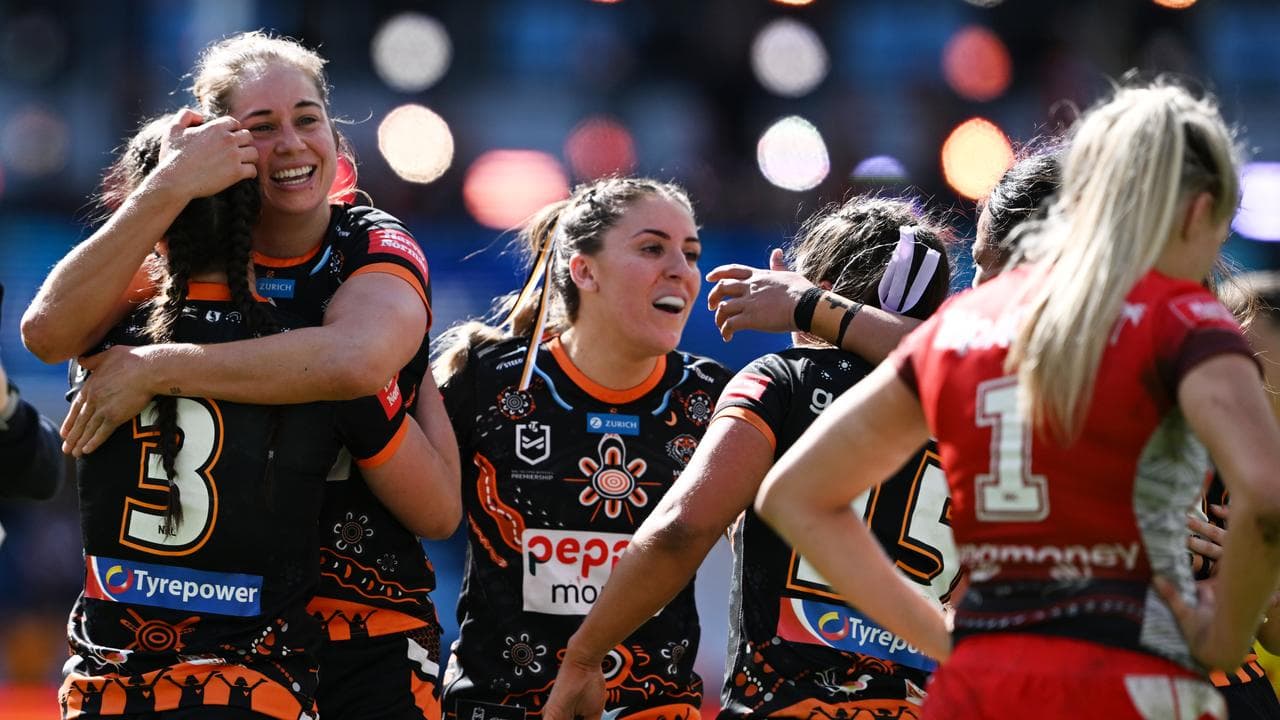 Kezie Apps of the Tigers celebrate their win over the Dragons