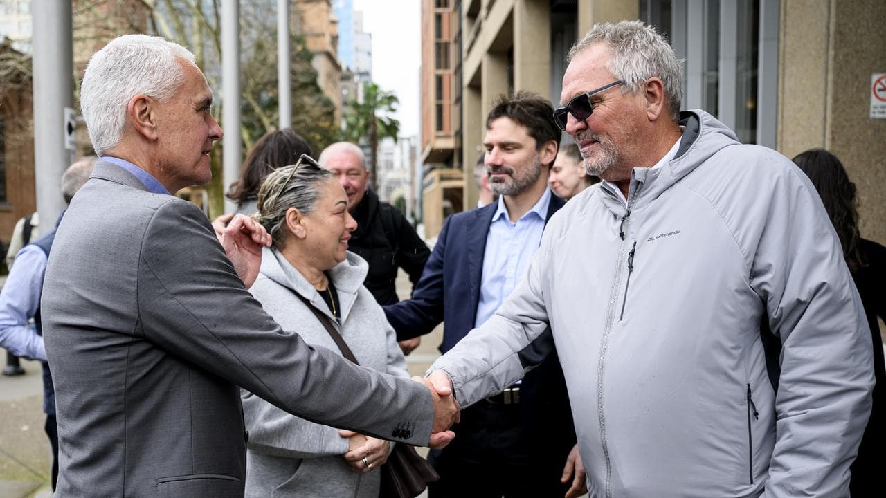 TWU National Secretary Michael Kaine and sacked worker Dom Dixon