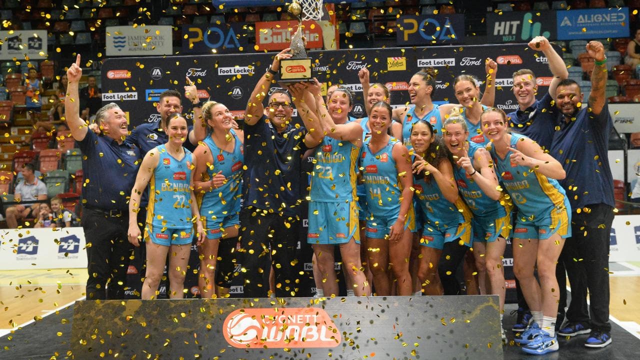 Bendigo Spirit players and officials celebrating.