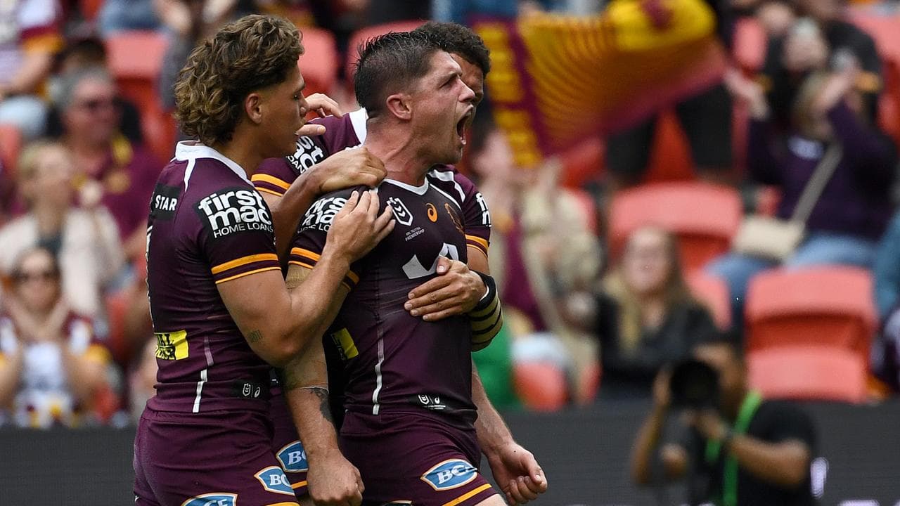 Brisbane hooker Cory Paix (right)
