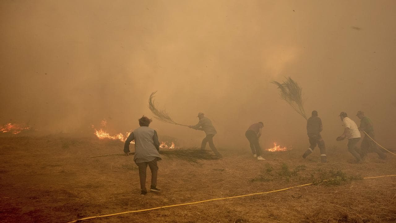 Residents battle a fire near Ourense, in northwestern Spain