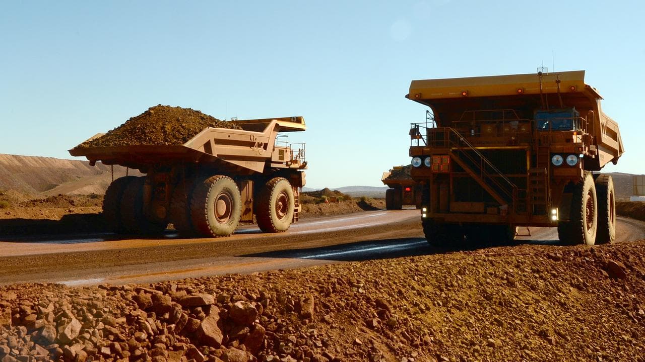 Haulage trucks at an iron ore mine (file image)