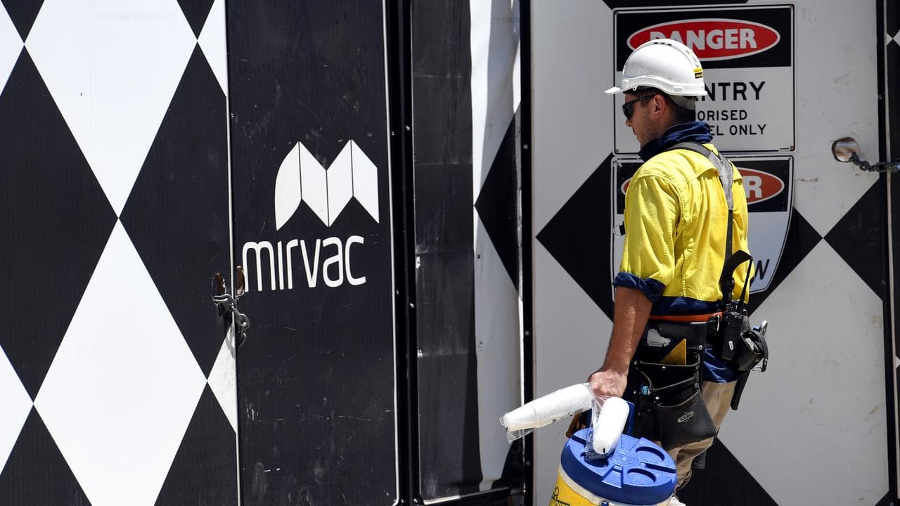 A worker enters a Mirvac construction site (file image)