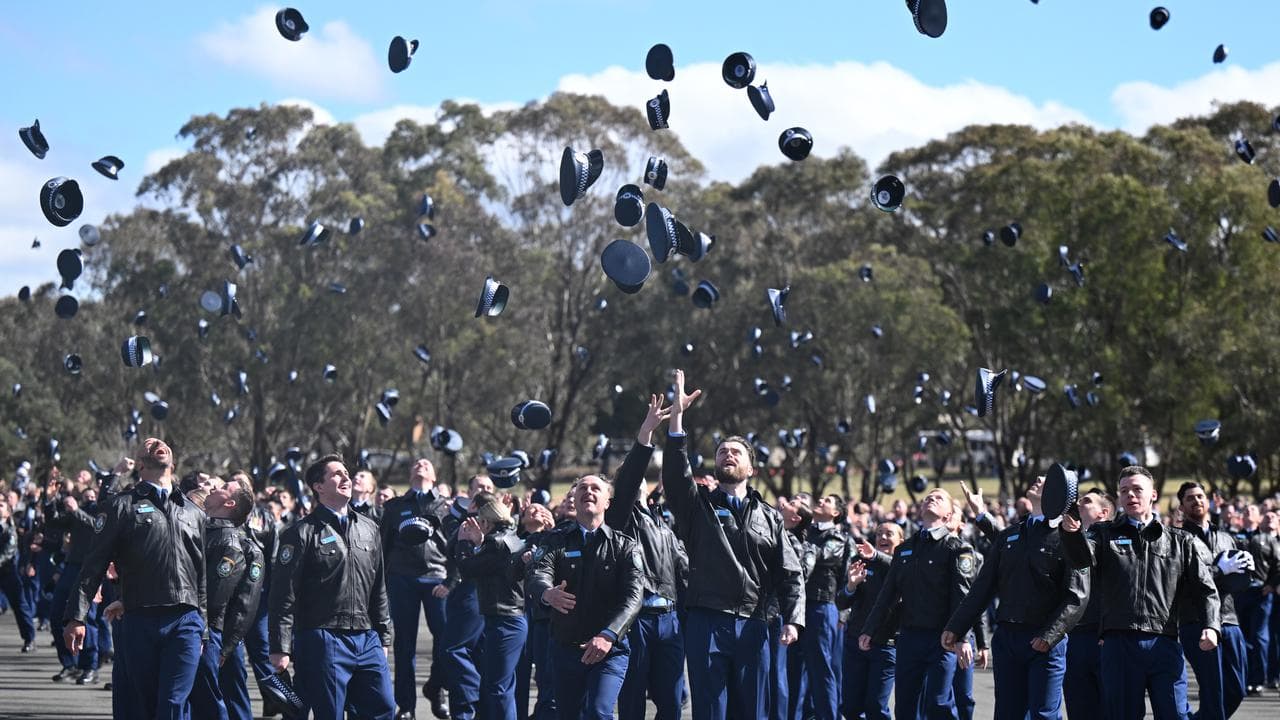 NSW Police cadets throw their hats in the air