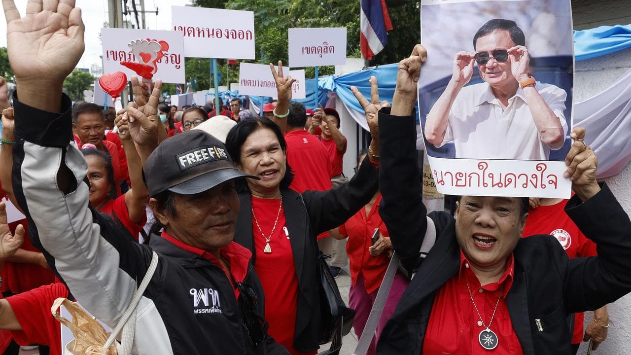 Supporters of Thaksin Shinawatra outside court in Bangkok