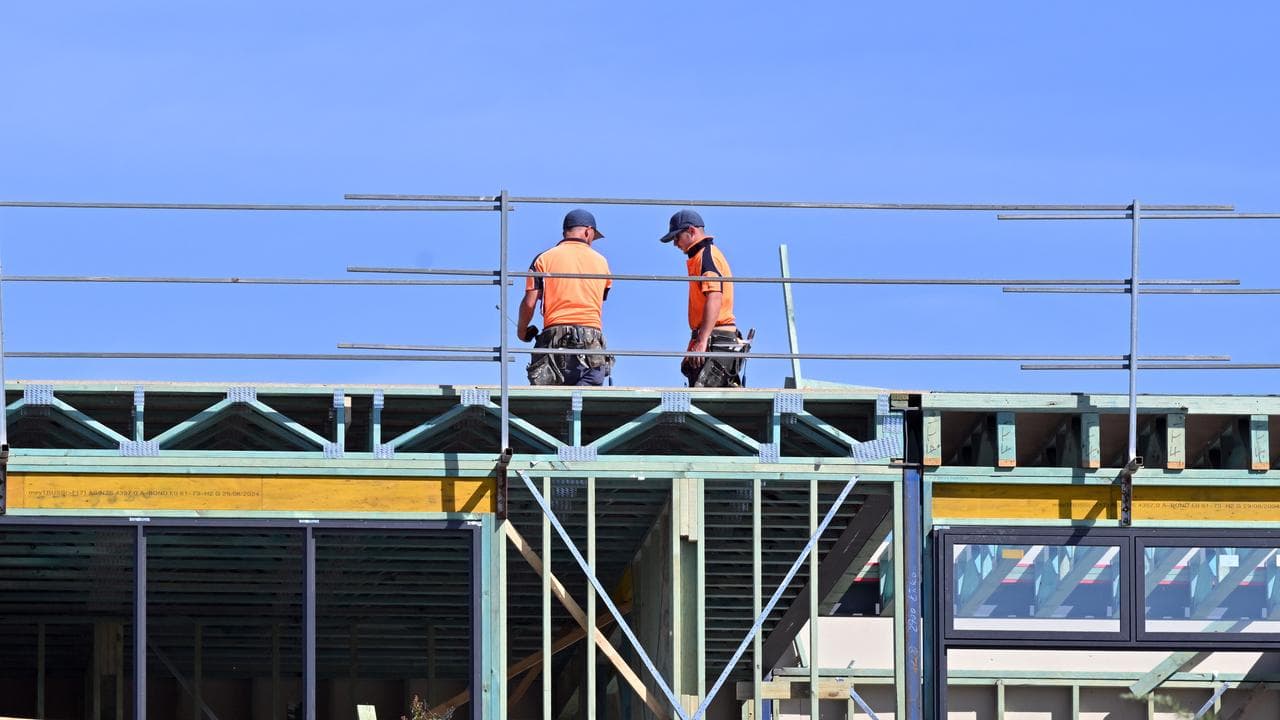 Workers at a housing development in the suburb of Wright in Canberra