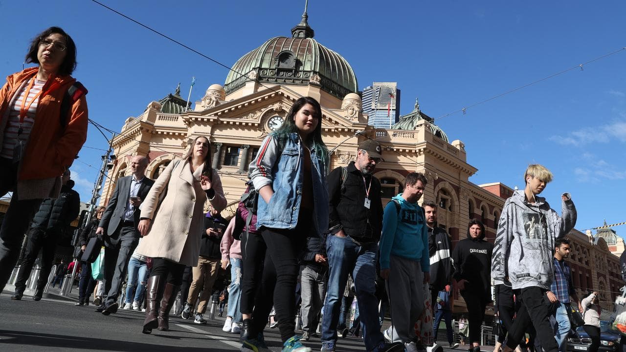 Pedestrians at Flinders St Station in Melbourne