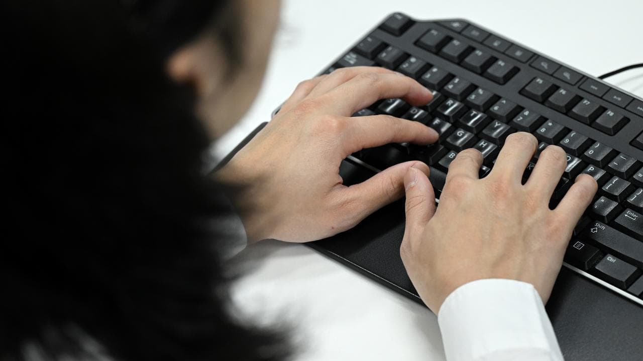 A file photo of a woman using a keyboard