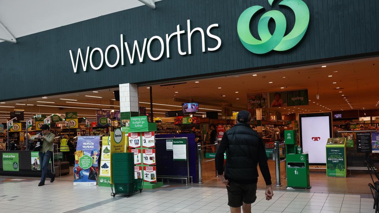 Shoppers at the Woolworths supermarket entrance (file image)