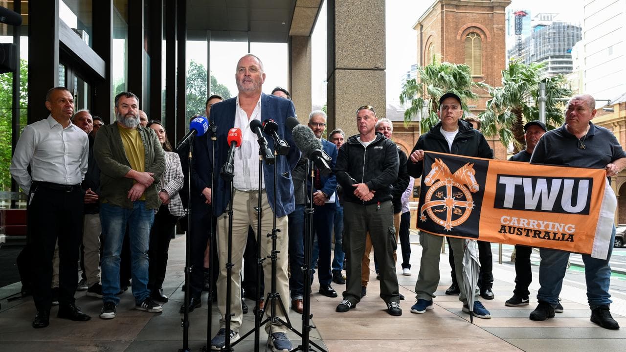 Sacked Qantas workers and union officials (file)