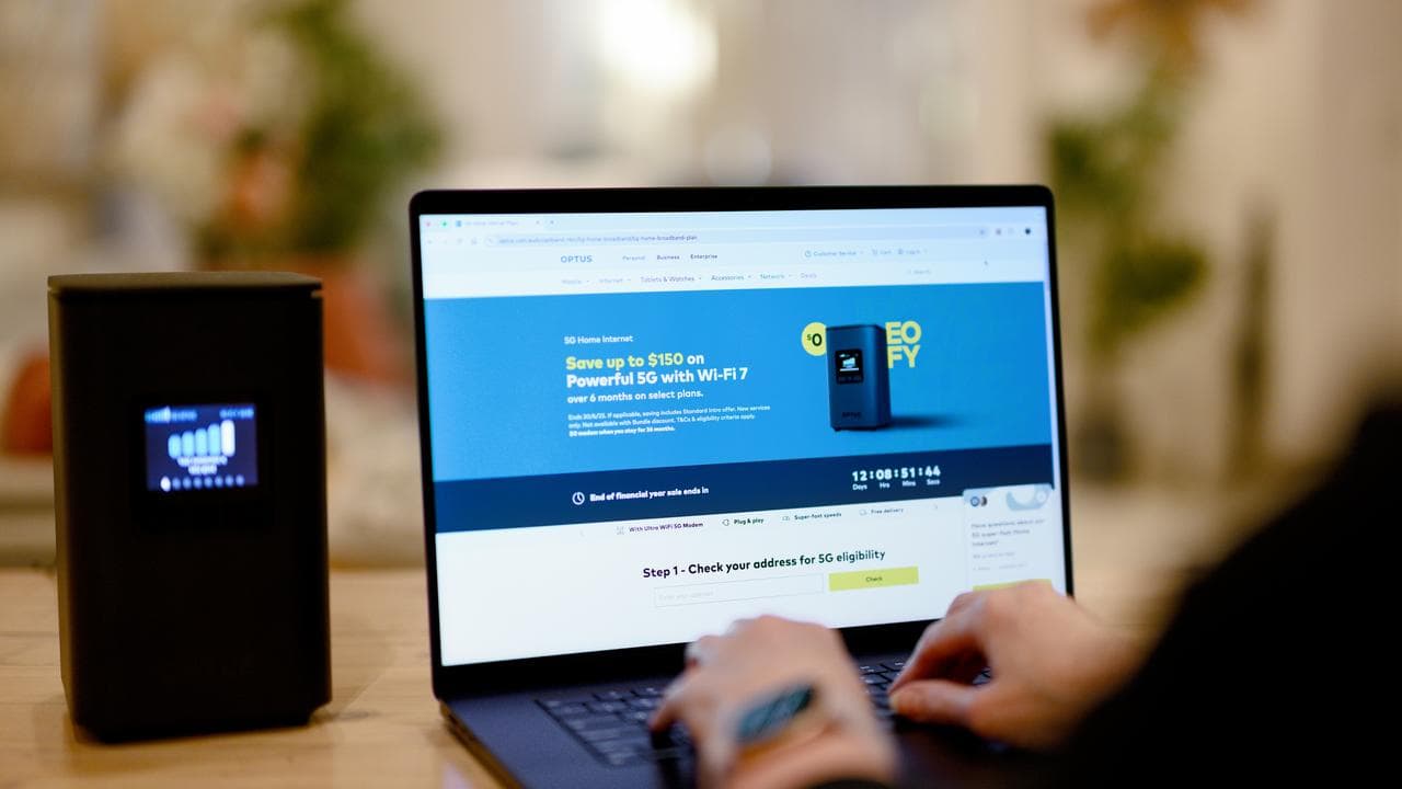 Optus website is seen on a laptop