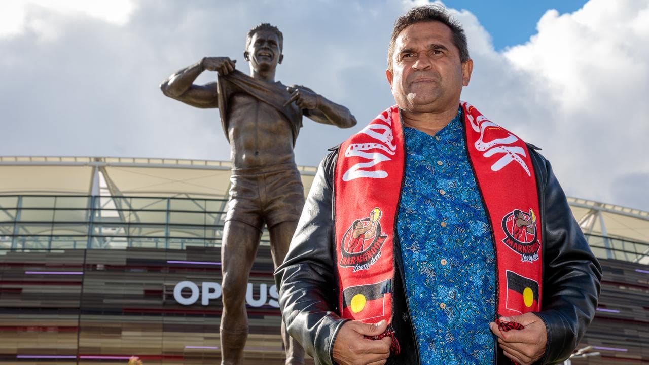 Nicky Winmar in front of his statue (file image)