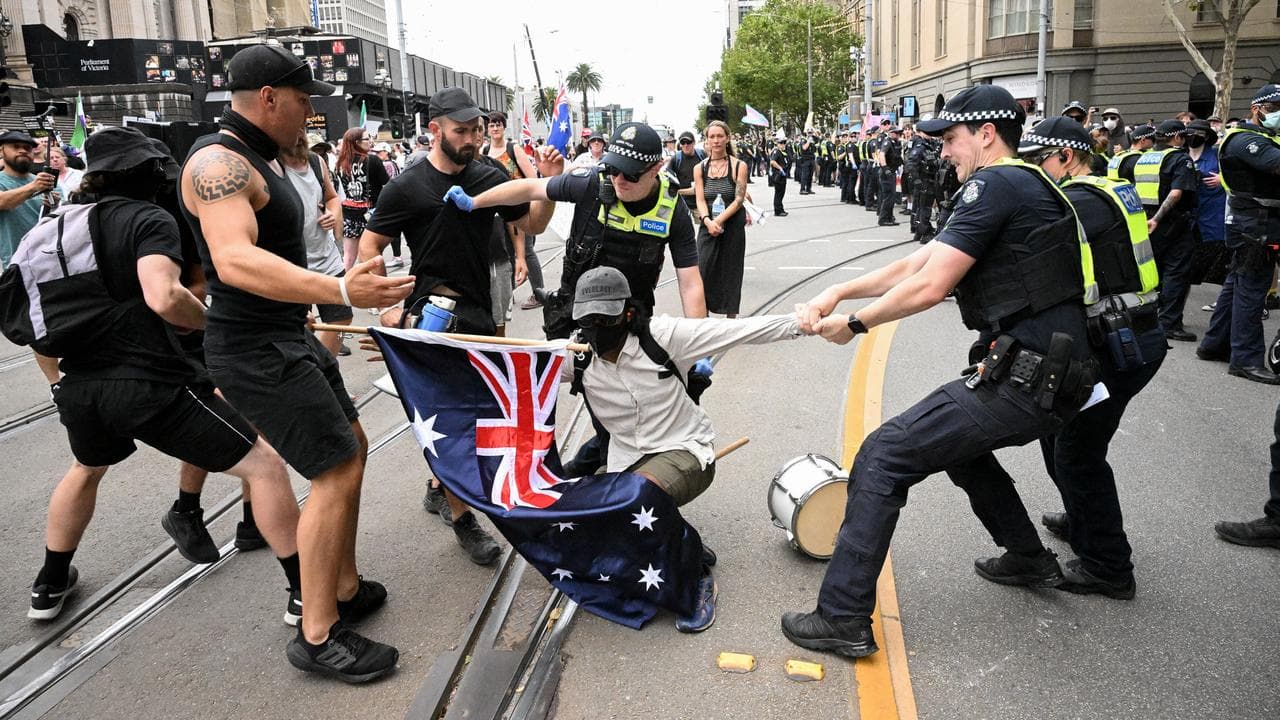 Police remove a protester during a transgender rights rally,