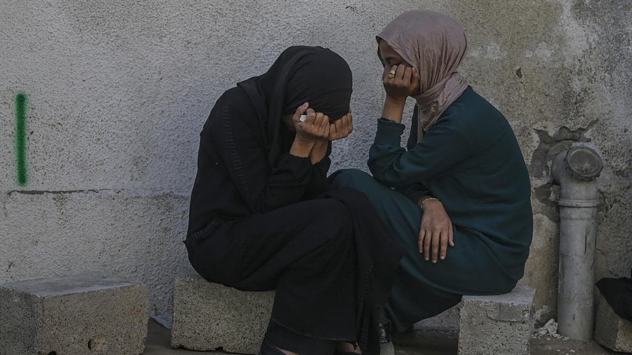 Two Palestinian women mourning dead relatives