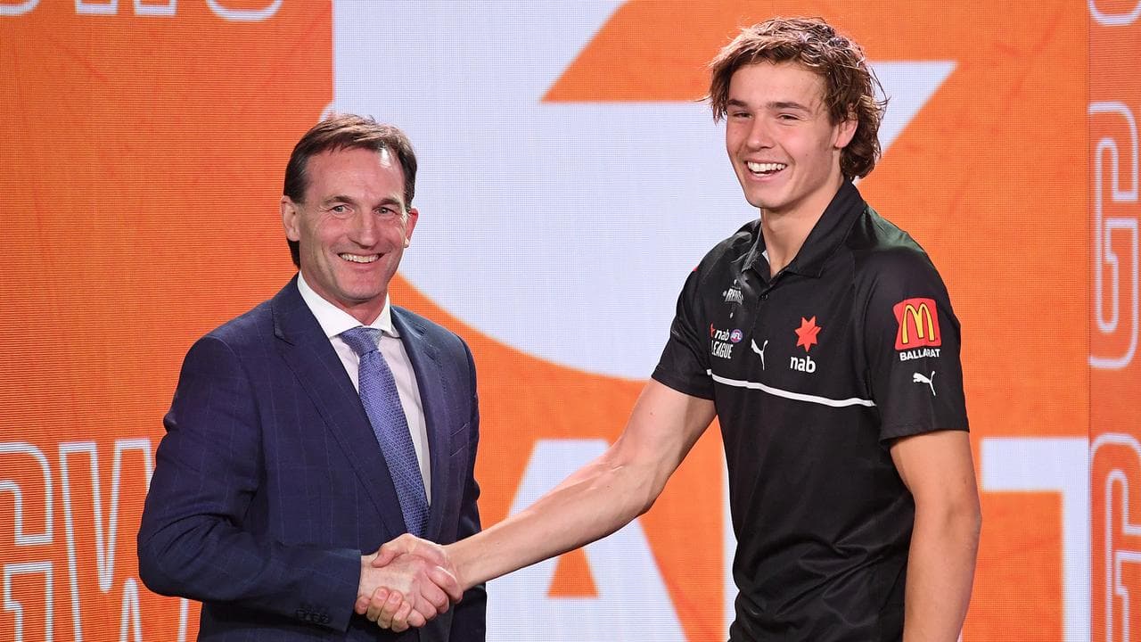 Andrew Dillon congratulates Aaron Cadman