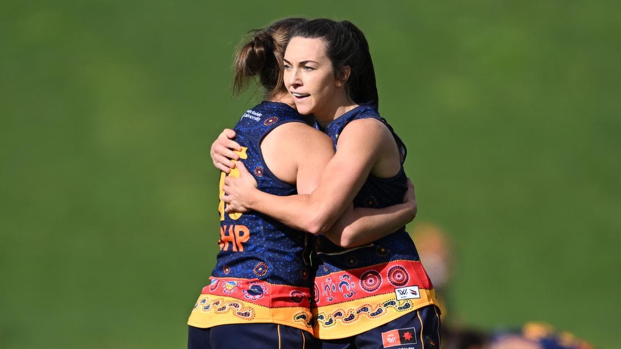 The Crows celebrate their win