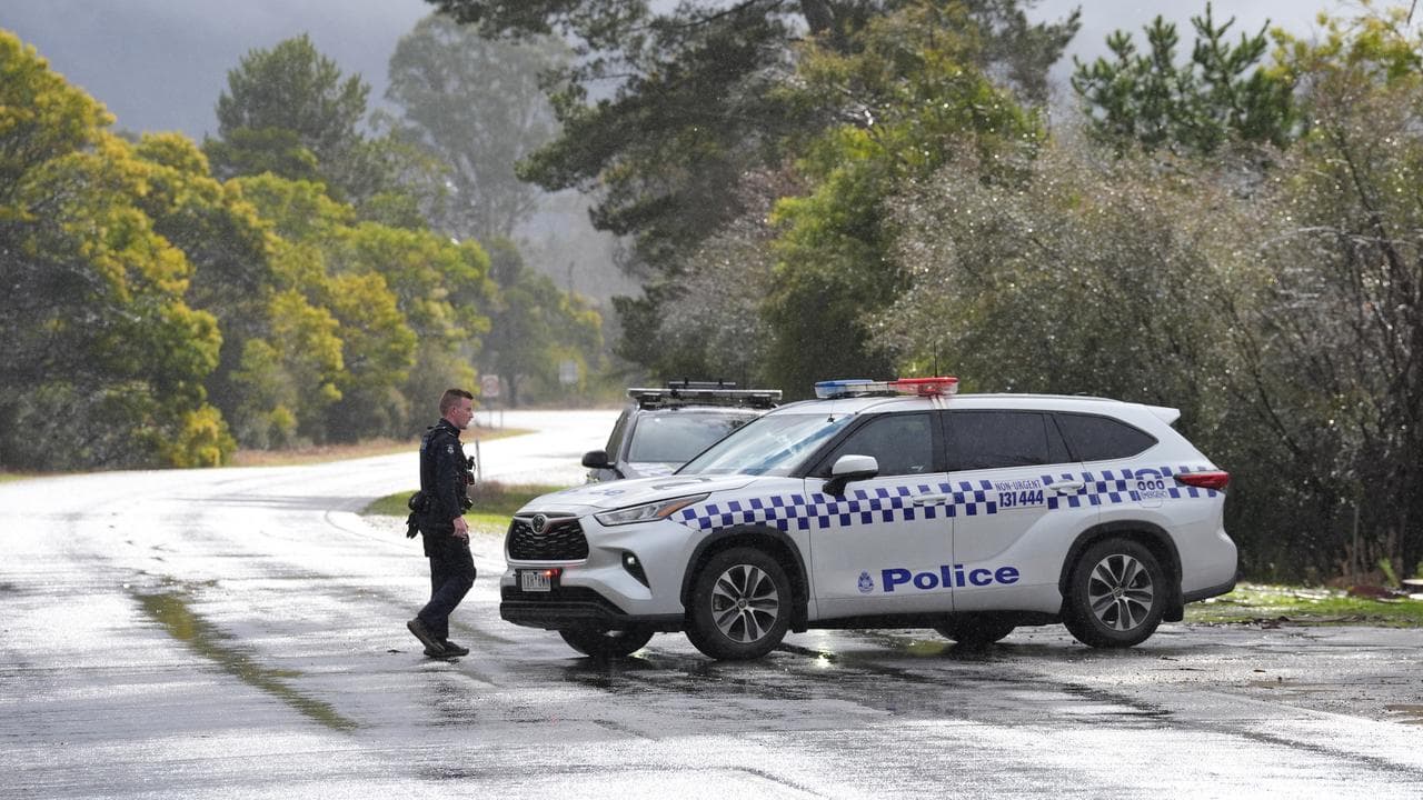 Victorian Police close a road near the Mount Buffalo Caravan Park
