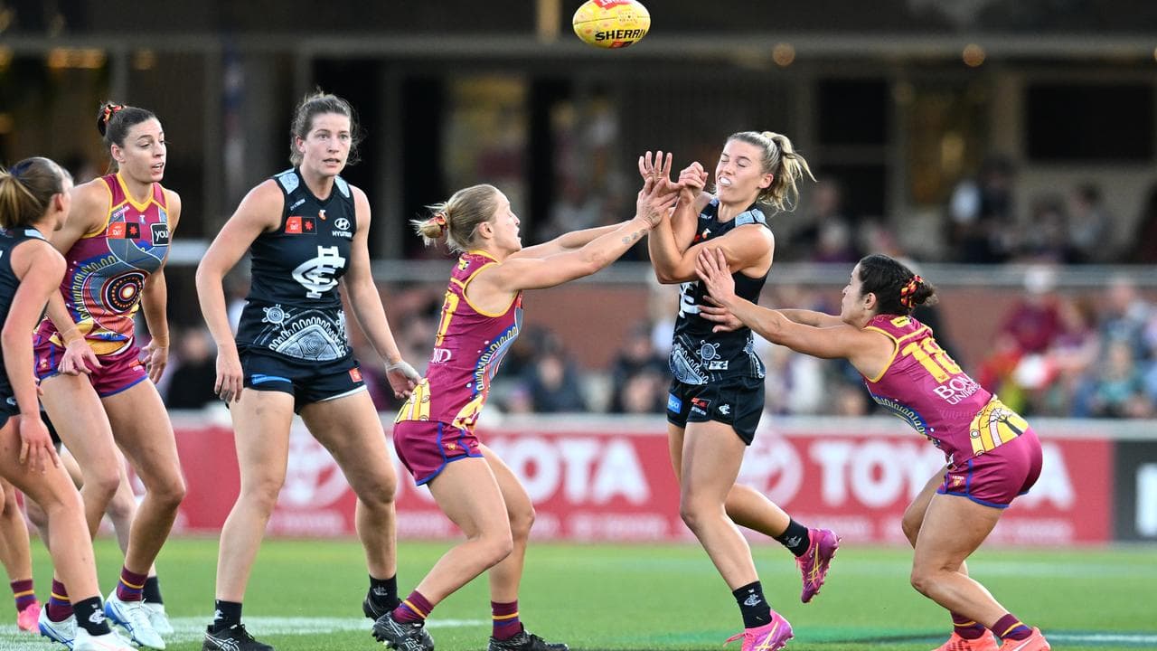Abbie McKay (centre) of the Blues.