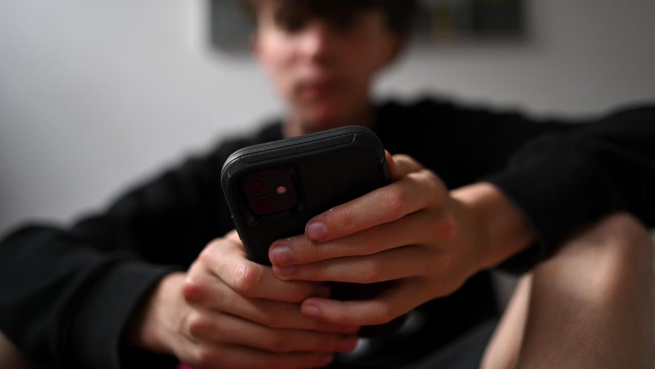 A boy on his phone
