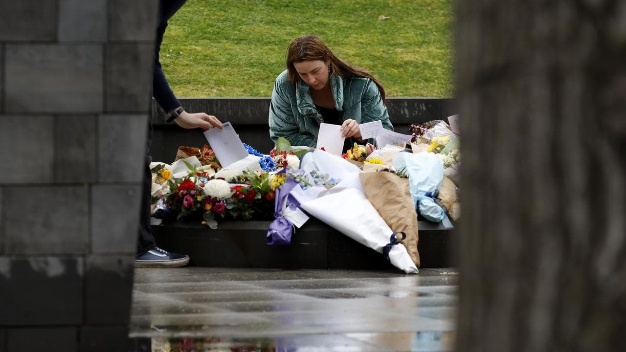 People place floral tributes at the Police Memorial (file image)
