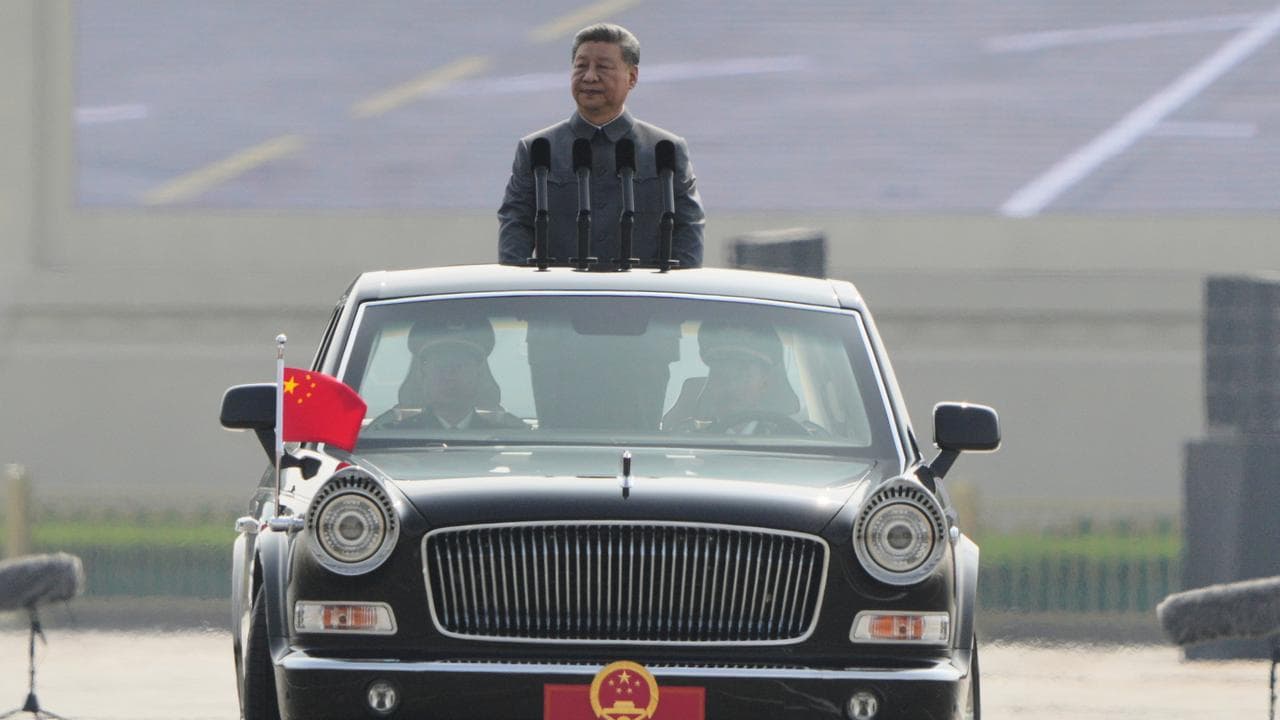 President Xi Jinping inspects the troops at a parade in Beijing
