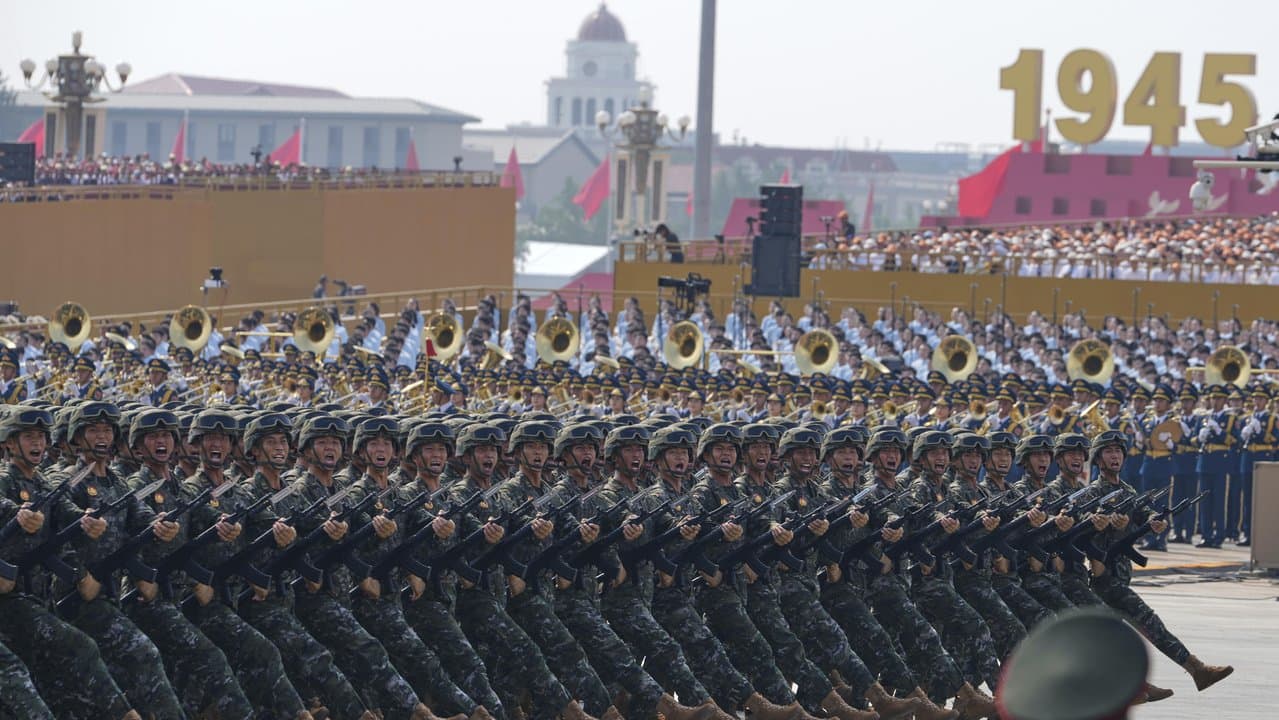 Military personnel take part in a military parade in Beijing