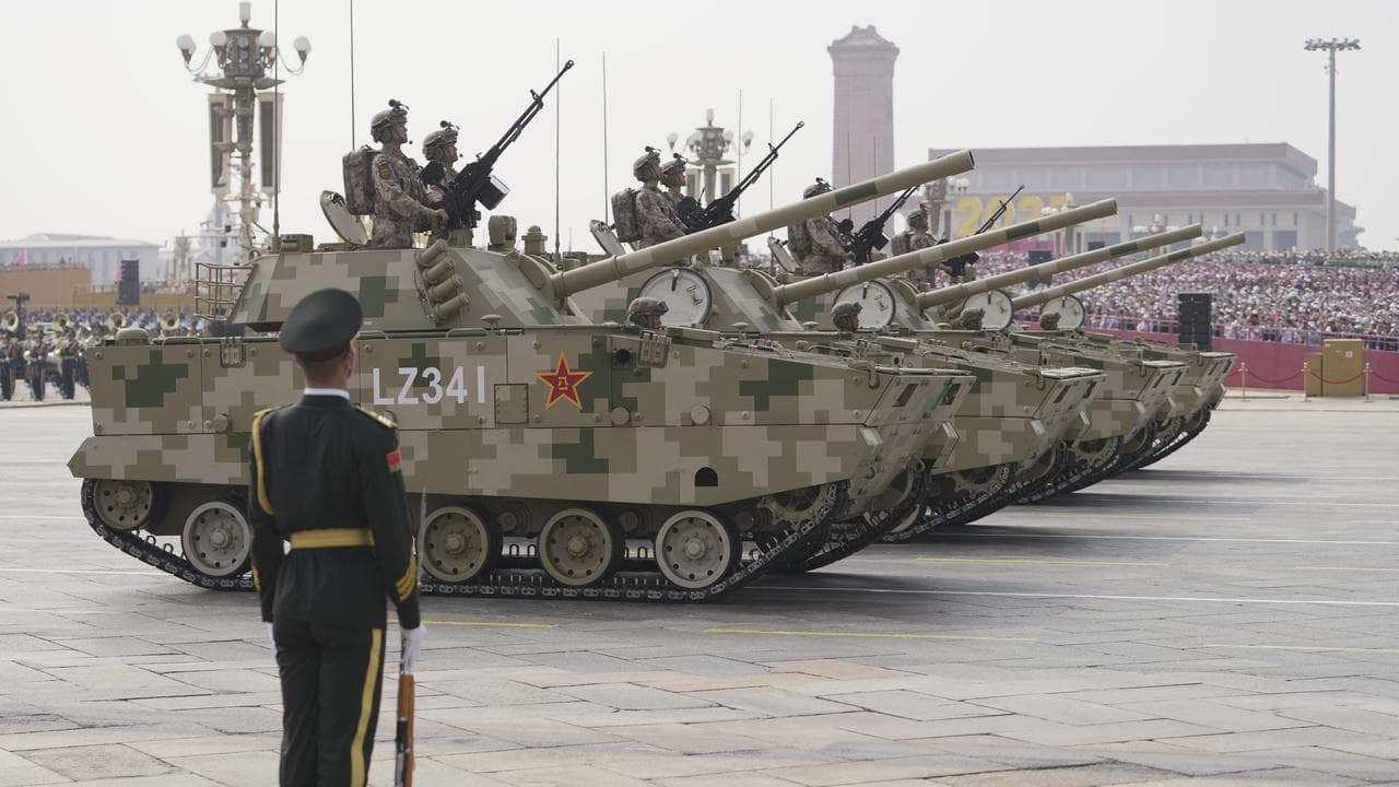 Armoured vehicles take part in a military parade in Beijing