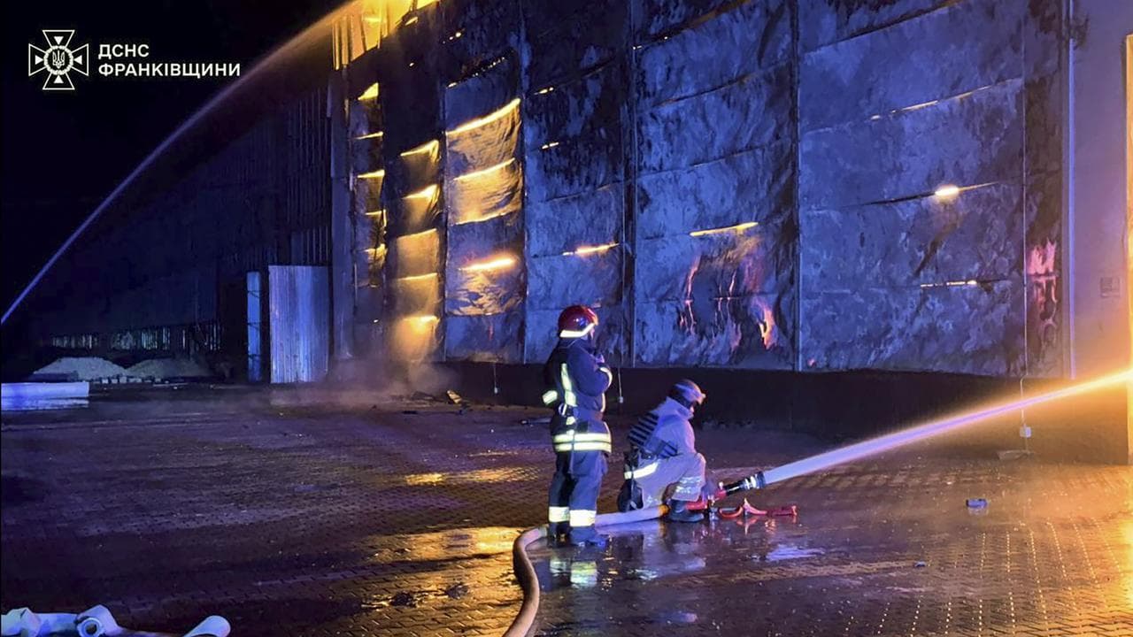 Ukrainian rescuers at the site of Russian shelling