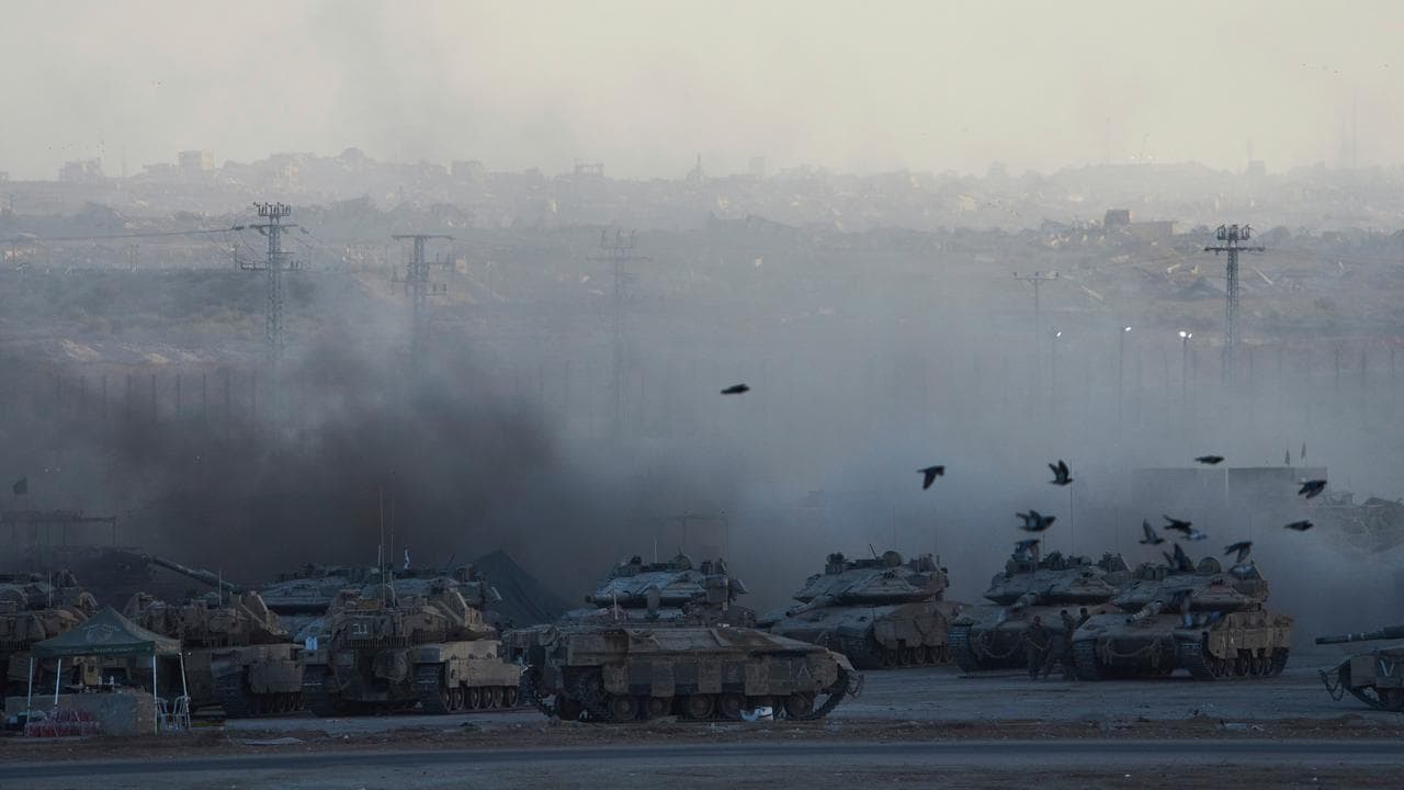 Israeli tanks in a gathering area on the border with the Gaza Strip