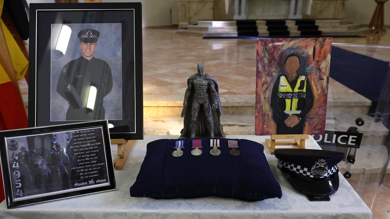 Photographs and personal belongings are displayed