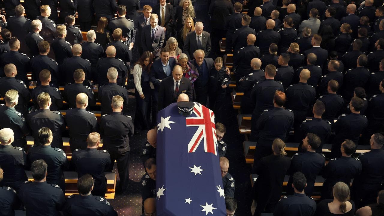Family members at  Police officer Vadim De Waart-Hottart's funeral