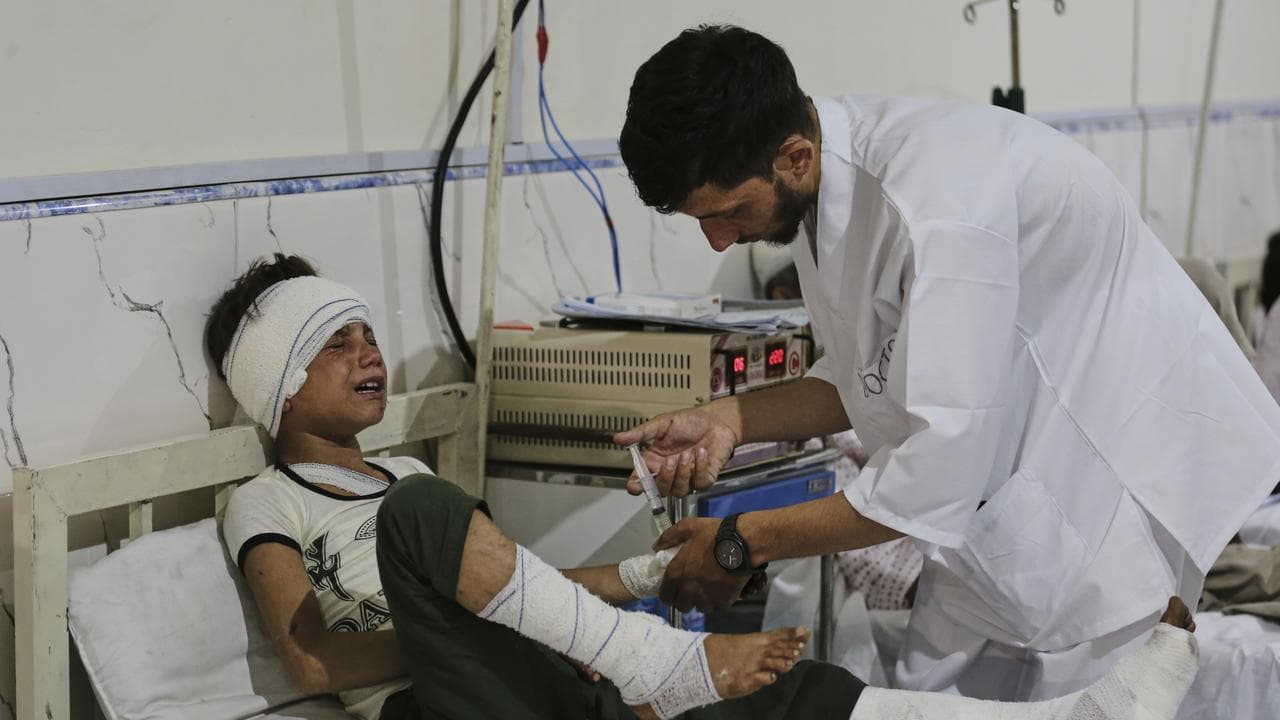 An Afghan boy injured in an earthquake is treated in Jalalabad