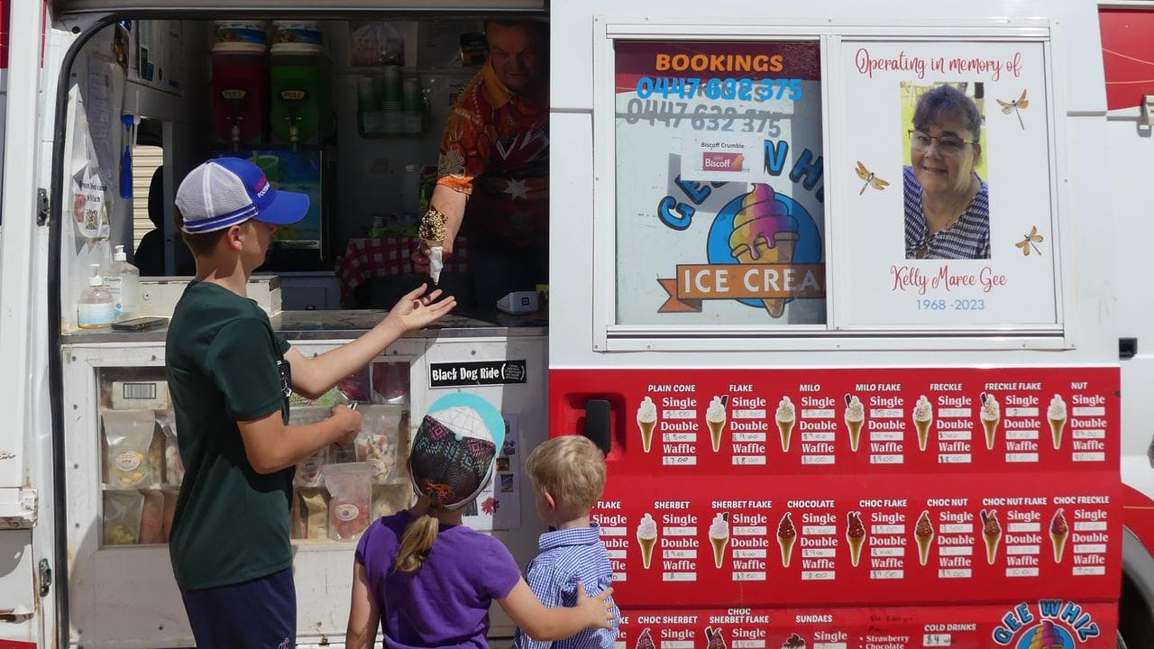 Gee Whiz ice cream van operator Ruskin Gee serves customers