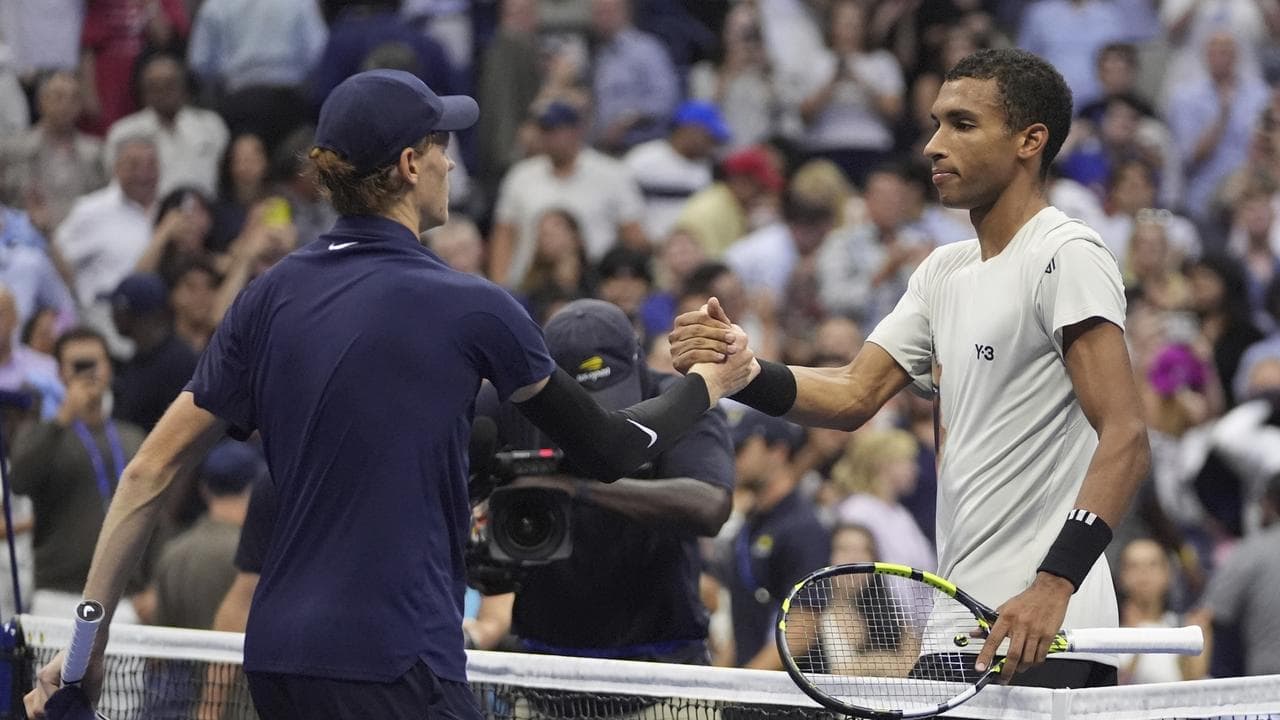 Jannik Sinner and  Felix Auger-Aliassime shake hands