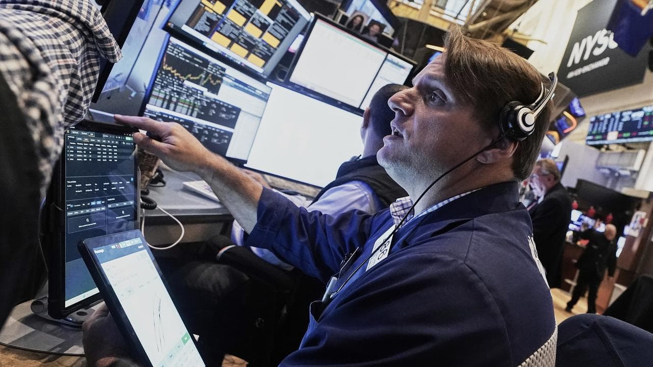 Trader Michael Milano works on the New York Stock Exchange