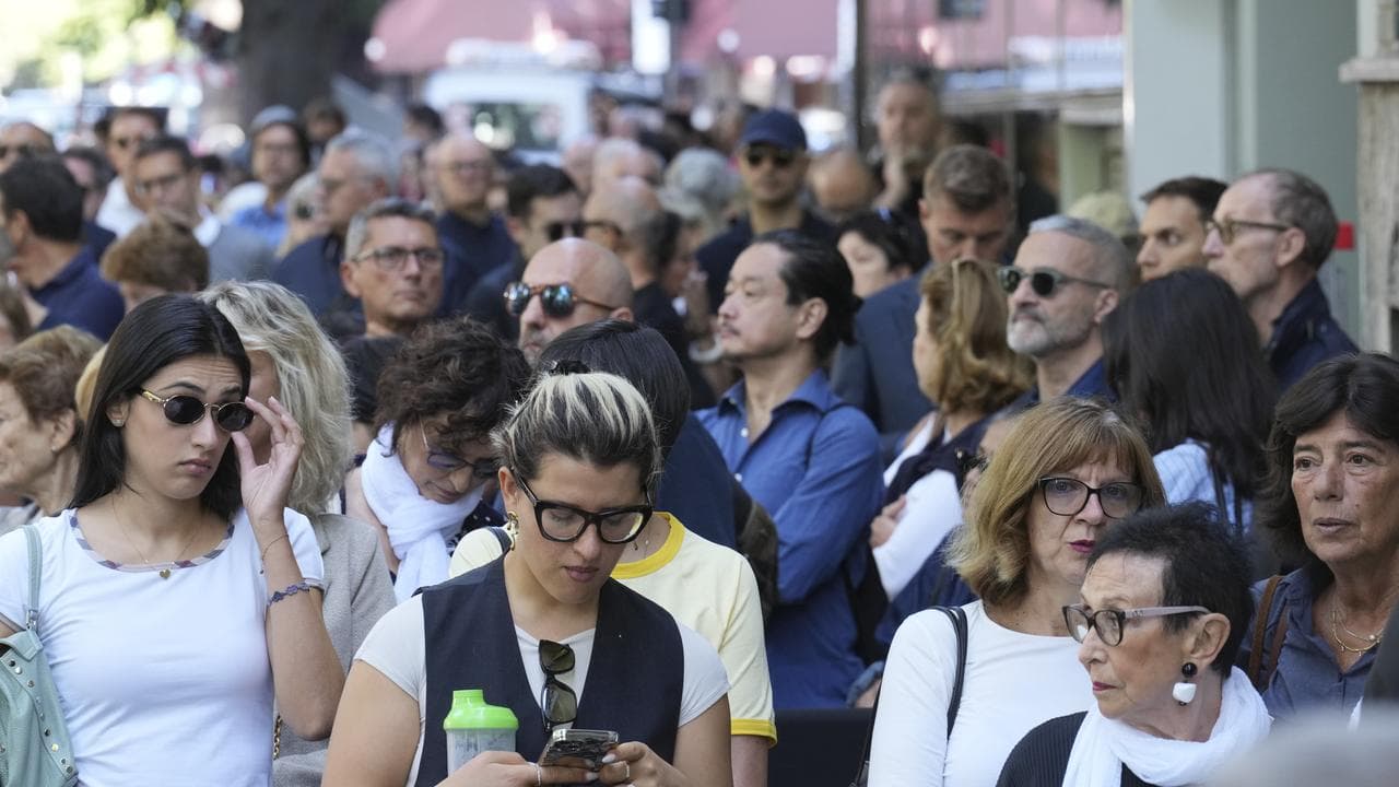 People line up in Milan to pay their respects to Giorgio Armani
