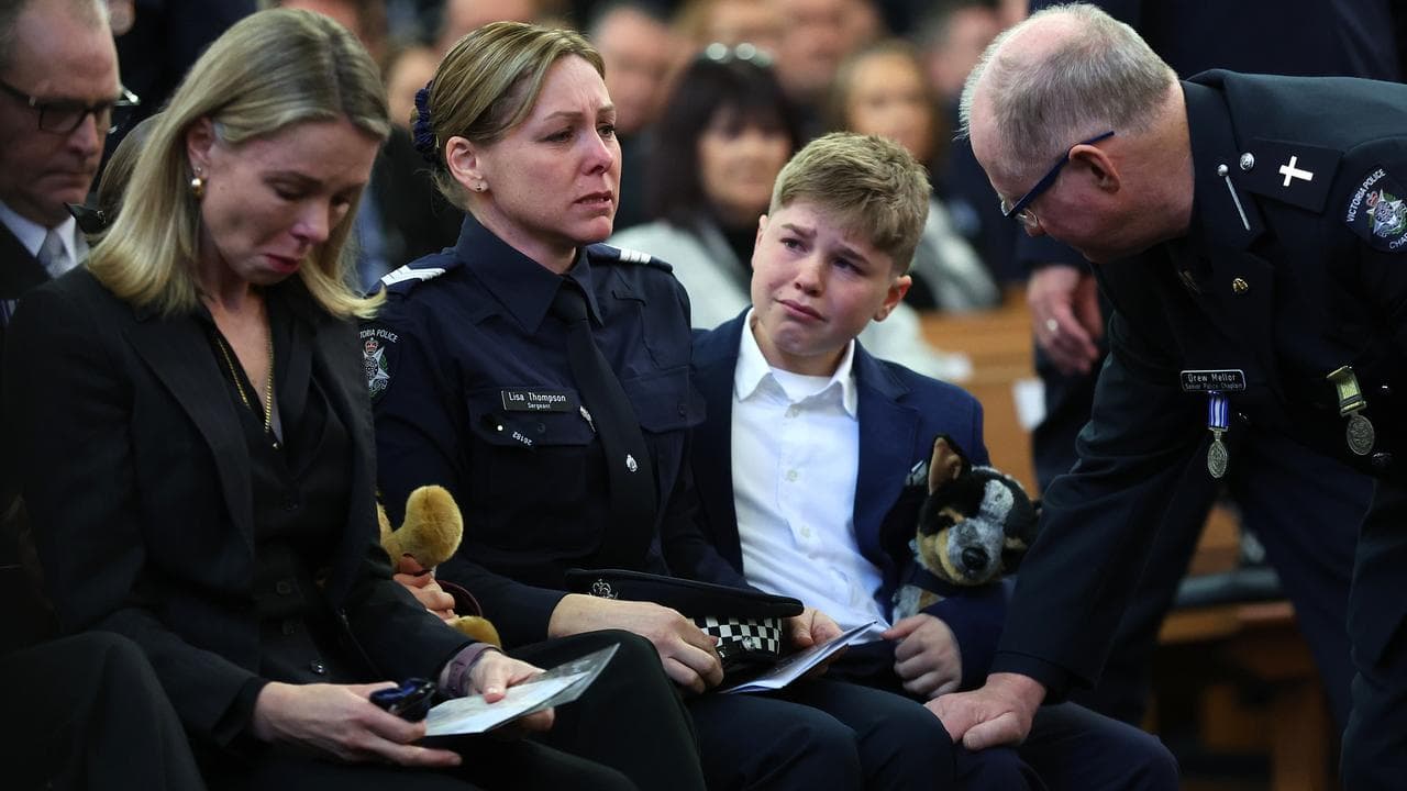 His wife Sergeant Lisa Thompson (second left)
