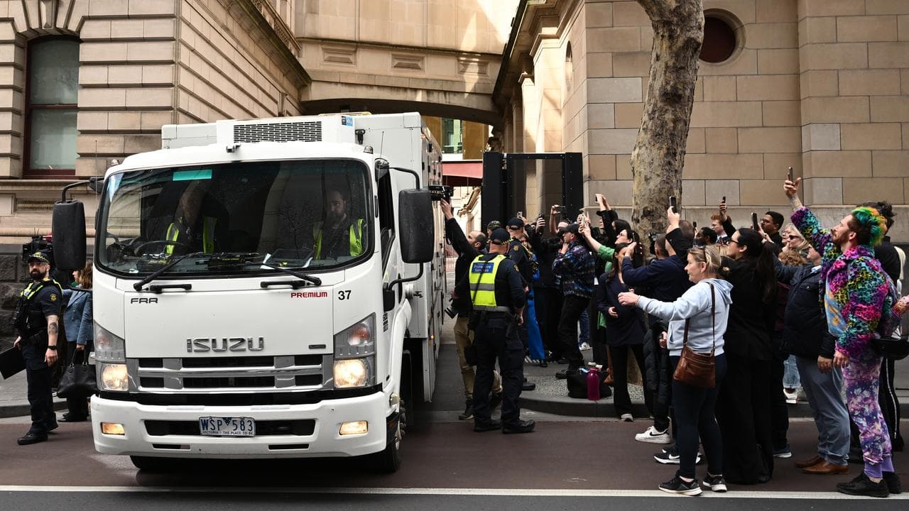 A prison van carrying Erin Patterson leaves the Supreme Court